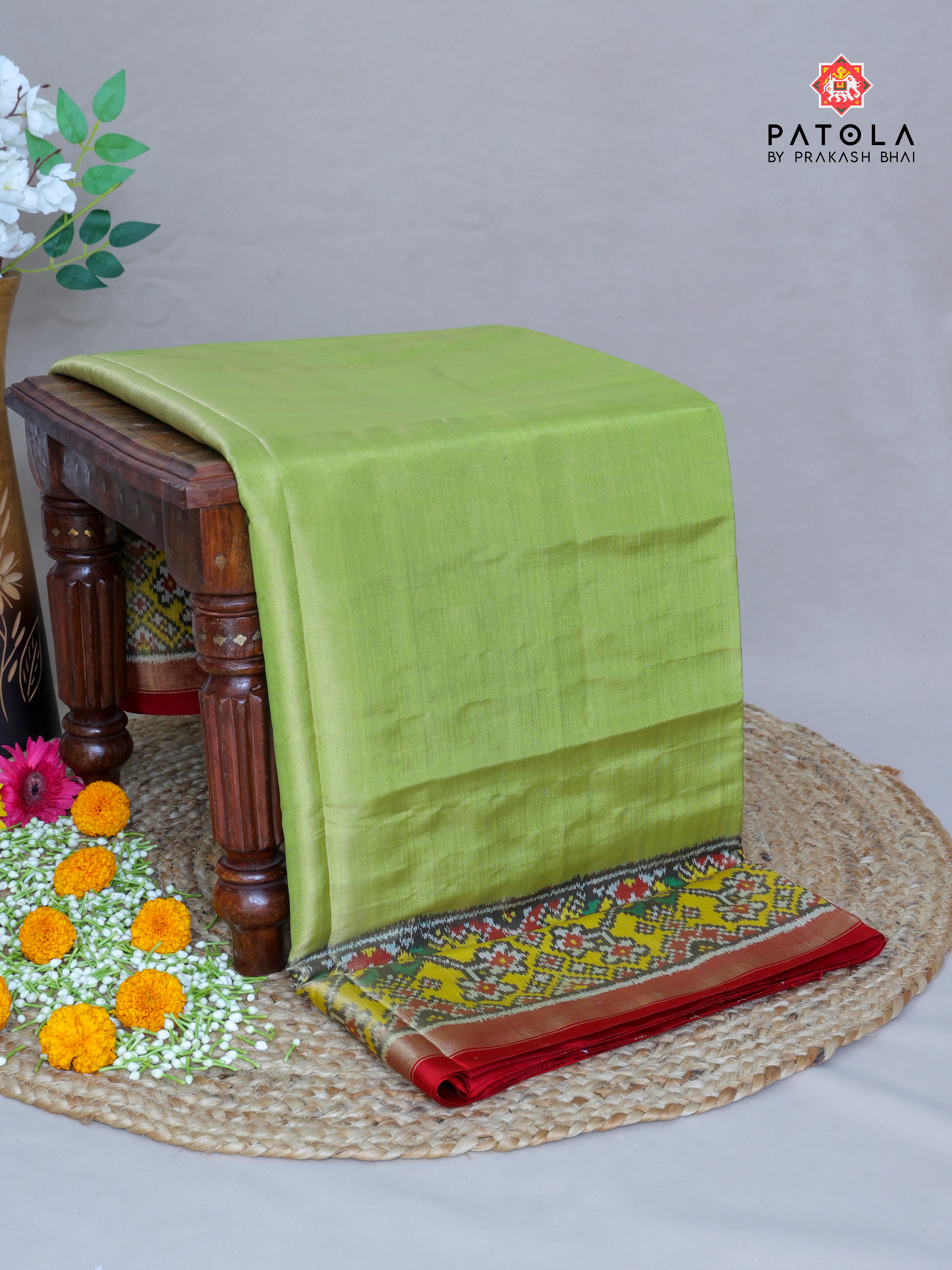 Plain Pista Green With Yellow Navratna Border Tissue Patola Saree